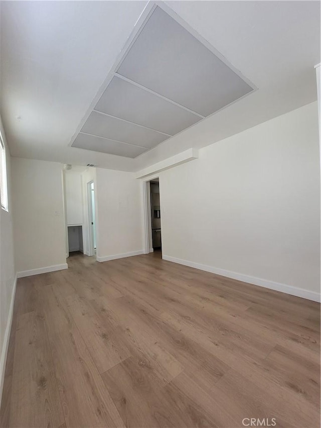 spare room featuring light wood-type flooring