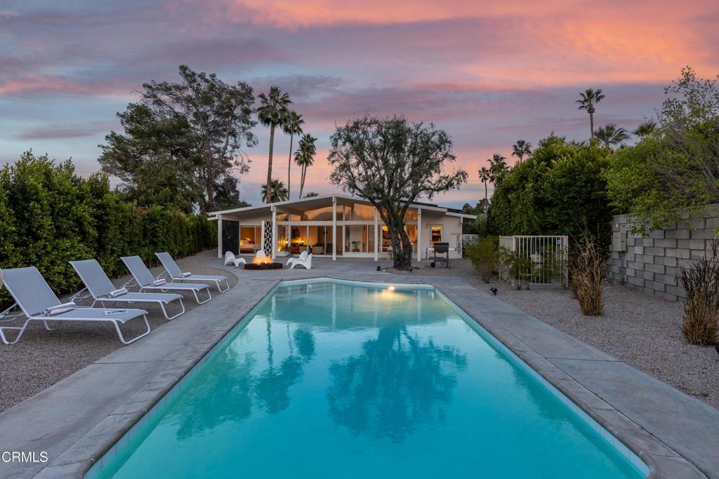 view of swimming pool featuring a fenced in pool, a patio area, and fence