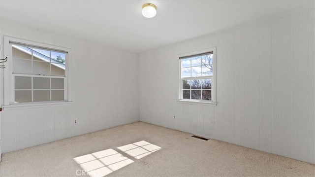 empty room featuring light colored carpet