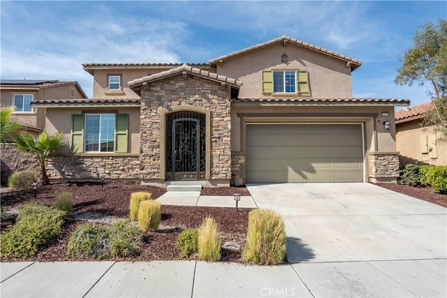 mediterranean / spanish-style house with a garage