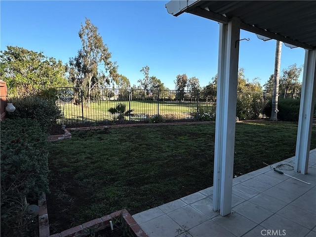 view of yard featuring a patio area and a fenced backyard