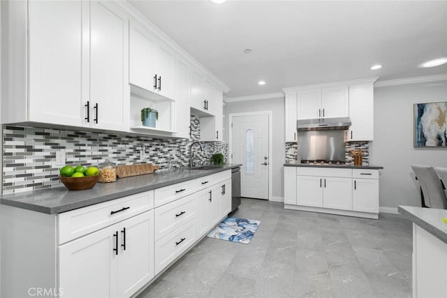 kitchen with appliances with stainless steel finishes, sink, and white cabinetry