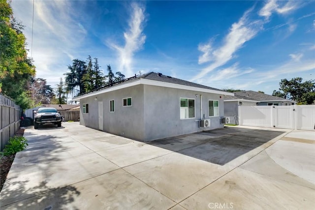 view of side of home with a patio