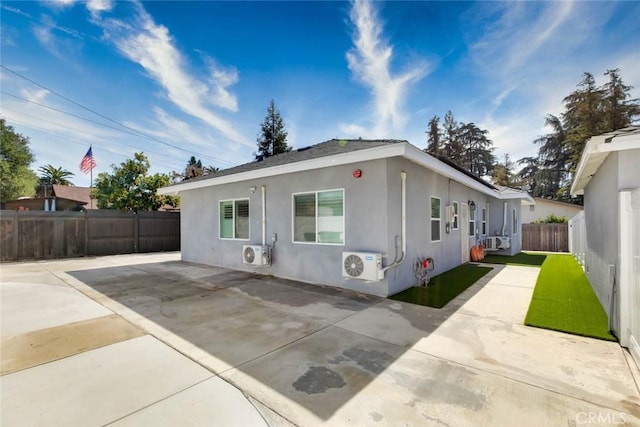 ranch-style home with ac unit, a patio area, and cooling unit