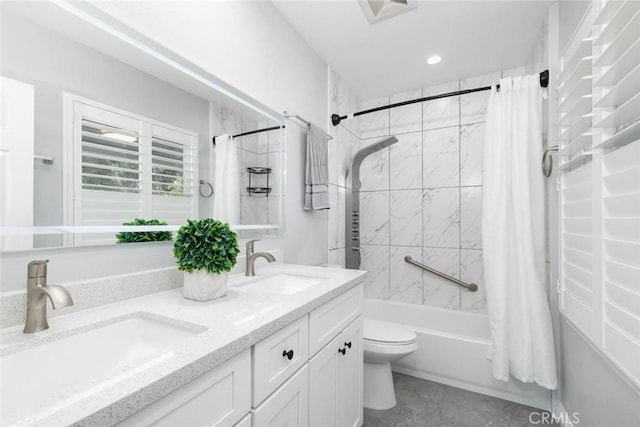 full bathroom with toilet, vanity, and shower / bath combination with curtain