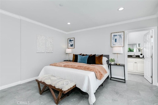 bedroom featuring sink, crown molding, and connected bathroom