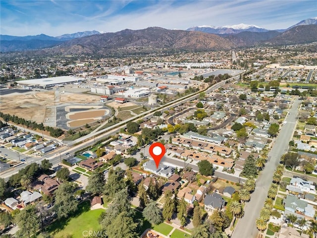 birds eye view of property with a mountain view