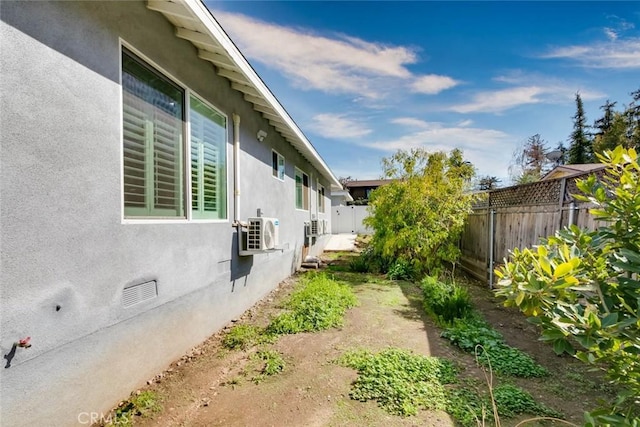 view of side of property with ac unit