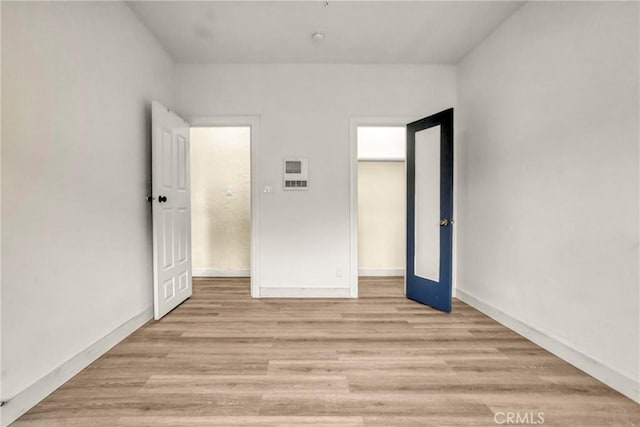3438 Mckinley Ave, Los Angeles, CA 90011 - unfurnished bedroom with light wood-style flooring and baseboards