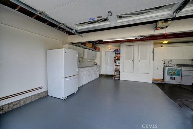 3067 Trinity Dr, Costa Mesa, CA 92626 - garage featuring washing machine and clothes dryer and freestanding refrigerator