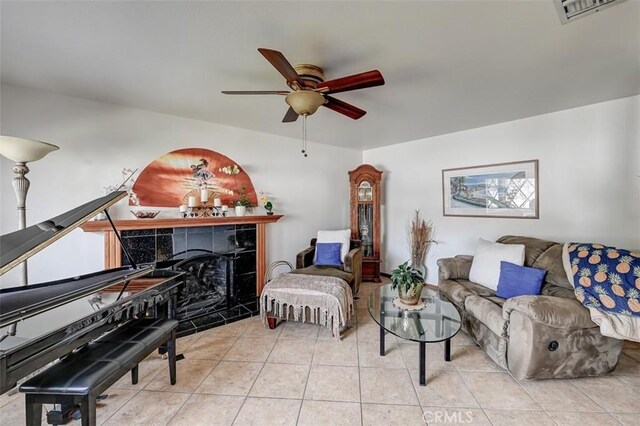 3067 Trinity Dr, Costa Mesa, CA 92626 - living room with a tiled fireplace, visible vents, tile patterned flooring, and ceiling fan
