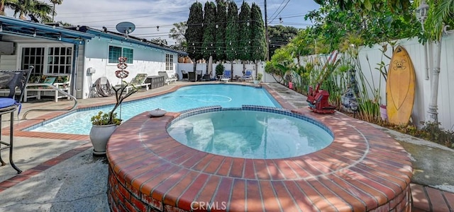 3067 Trinity Dr, Costa Mesa, CA 92626 - view of swimming pool with a pool with connected hot tub, a patio area, and a fenced backyard