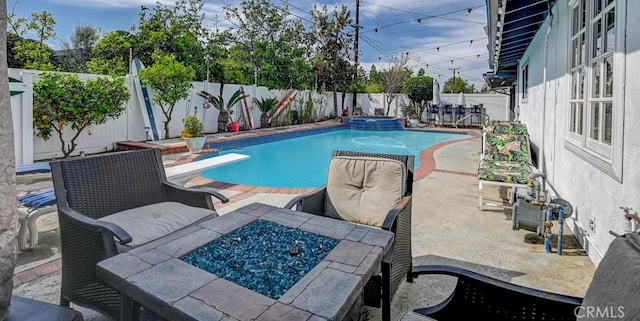 3067 Trinity Dr, Costa Mesa, CA 92626 - view of swimming pool featuring a pool with connected hot tub, a patio, a fenced backyard, and a diving board