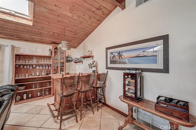 3067 Trinity Dr, Costa Mesa, CA 92626 - bar featuring lofted ceiling with beams, a dry bar, wooden ceiling, and light tile patterned floors