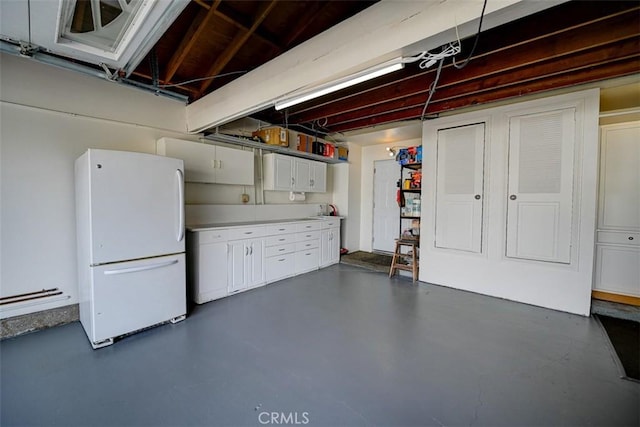 3067 Trinity Dr, Costa Mesa, CA 92626 - below grade area with freestanding refrigerator and baseboard heating