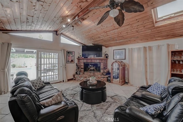 3067 Trinity Dr, Costa Mesa, CA 92626 - living area featuring vaulted ceiling with skylight, wooden ceiling, ceiling fan, and light tile patterned floors