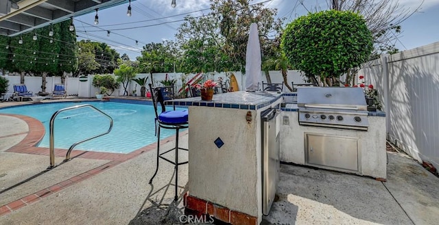 3067 Trinity Dr, Costa Mesa, CA 92626 - view of pool featuring area for grilling, a patio area, a fenced backyard, and a grill