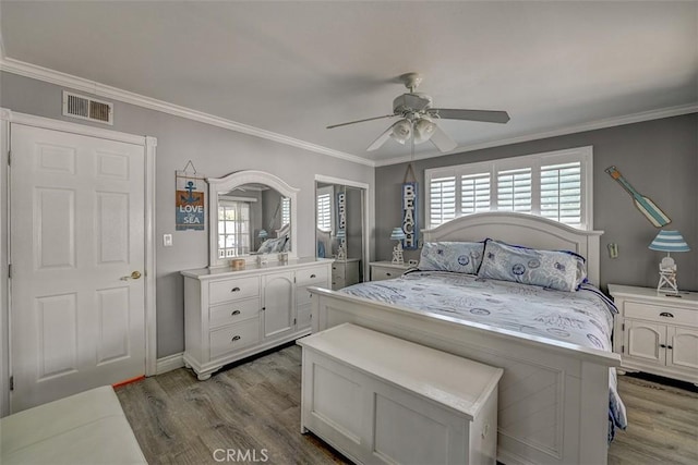 3067 Trinity Dr, Costa Mesa, CA 92626 - bedroom featuring wood finished floors, visible vents, ornamental molding, and multiple windows
