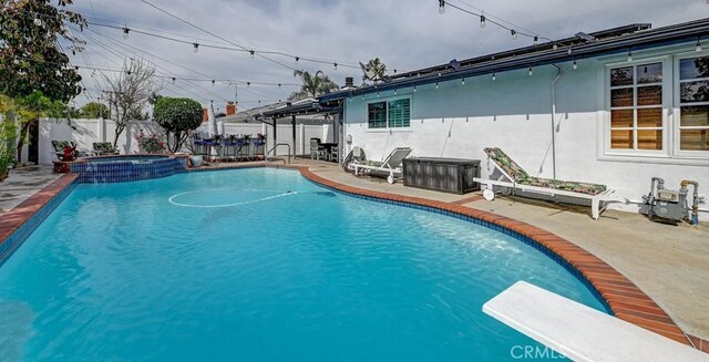 3067 Trinity Dr, Costa Mesa, CA 92626 - view of swimming pool featuring a fenced backyard, a diving board, a patio, and a pool with connected hot tub