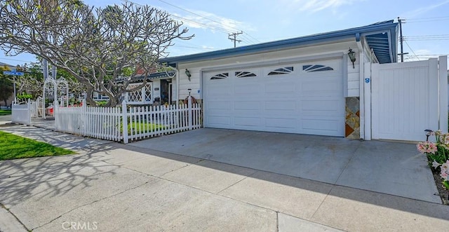 3067 Trinity Dr, Costa Mesa, CA 92626 - garage with fence and driveway