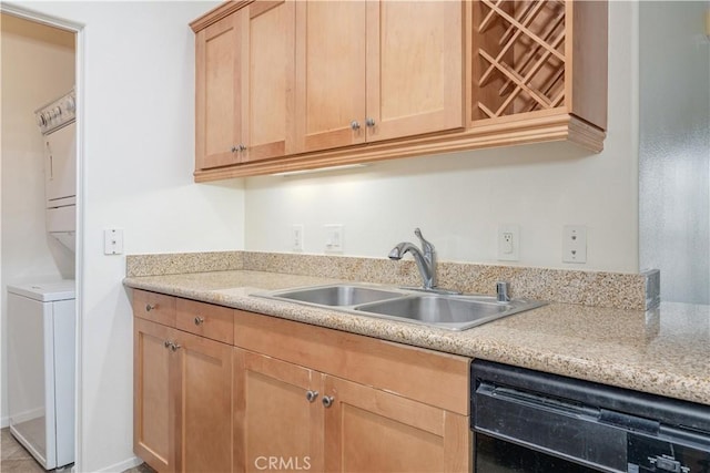 kitchen featuring light brown cabinets, stacked washer / dryer, a sink, light countertops, and dishwasher