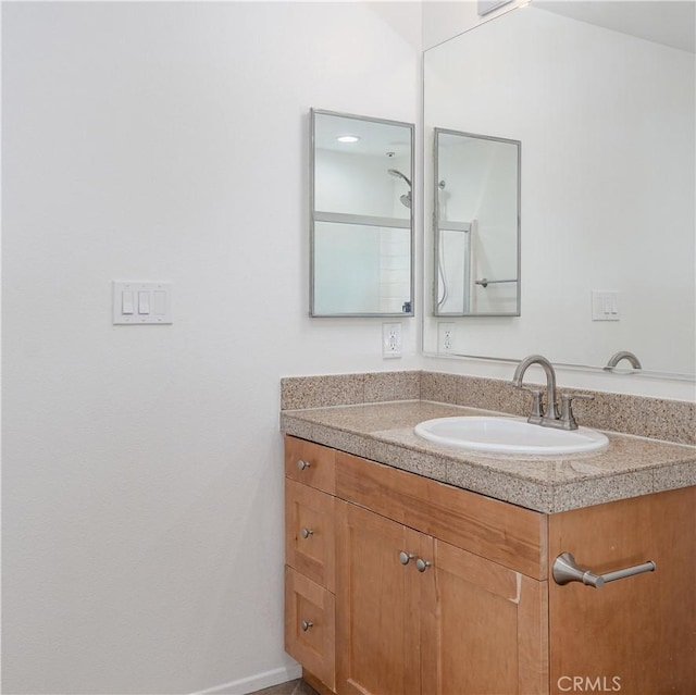 bathroom featuring vanity and baseboards