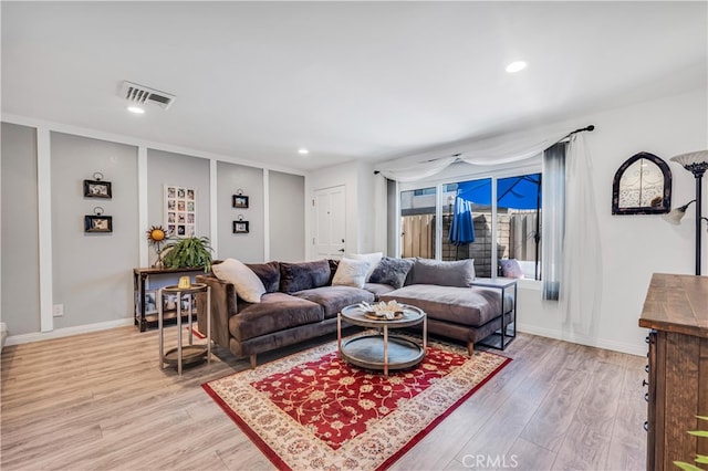 living room with light hardwood / wood-style flooring