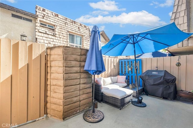 view of patio with a grill