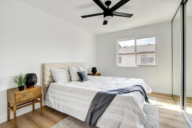 bedroom featuring ceiling fan and light hardwood / wood-style floors