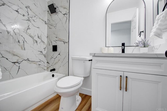 full bathroom with toilet, vanity, hardwood / wood-style floors, and tiled shower / bath combo