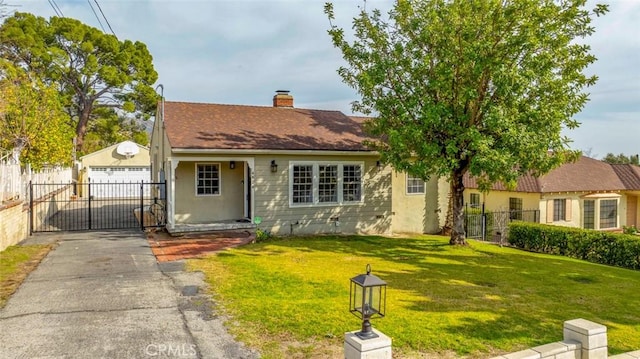 view of front of property with a front lawn and a garage