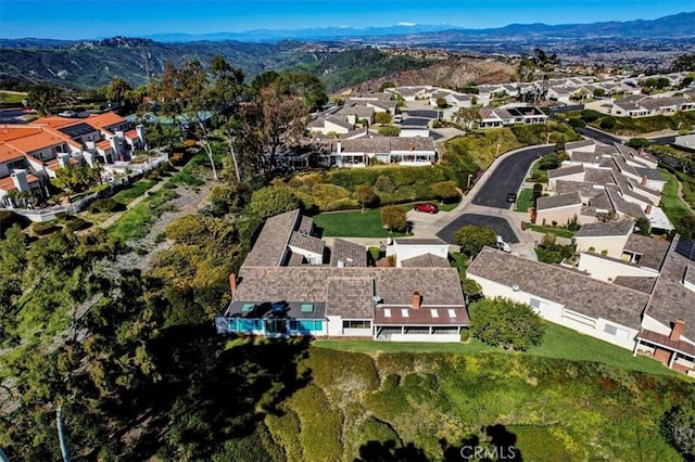 birds eye view of property featuring a residential view and a mountain view