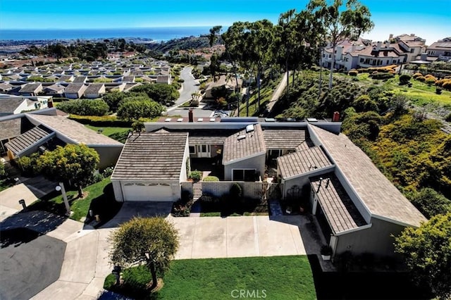 birds eye view of property with a residential view