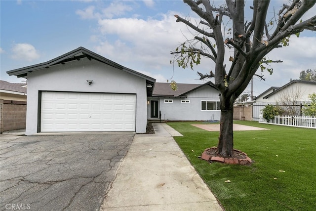 ranch-style house with a front lawn and a garage