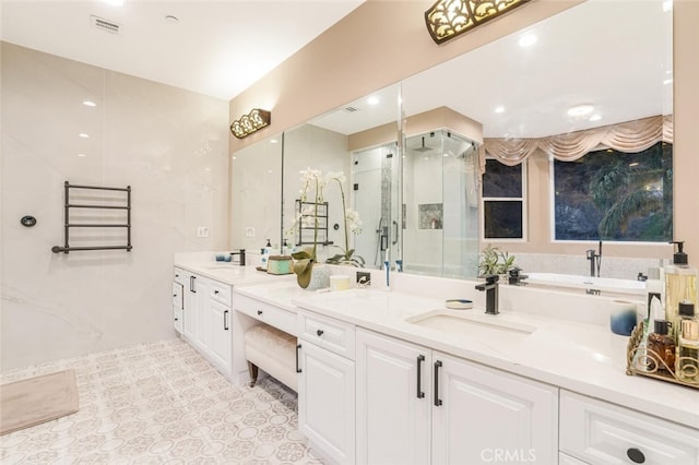 bathroom featuring tile walls, vanity, and walk in shower