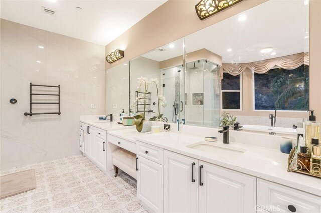 27 Round Up Rd, Bell Canyon, CA 91307 - full bathroom with a shower stall, double vanity, tile patterned flooring, and a bathtub