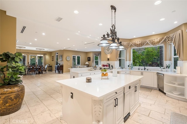 27 Round Up Rd, Bell Canyon, CA 91307 - kitchen featuring stone tile flooring, light countertops, a chandelier, and recessed lighting