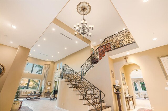 27 Round Up Rd, Bell Canyon, CA 91307 - foyer with a towering ceiling, recessed lighting, stairway, arched walkways, and a chandelier