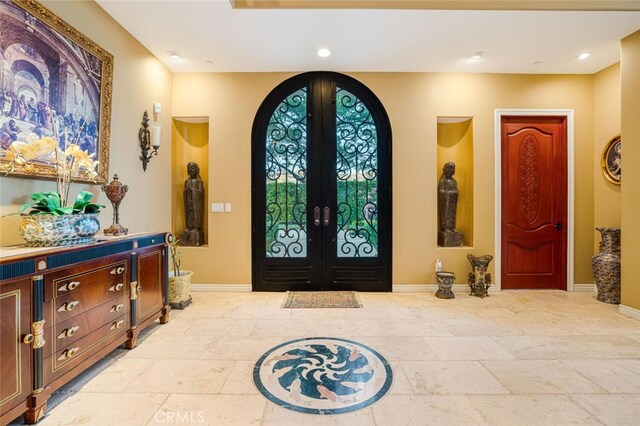 27 Round Up Rd, Bell Canyon, CA 91307 - entrance foyer with arched walkways, baseboards, french doors, and recessed lighting