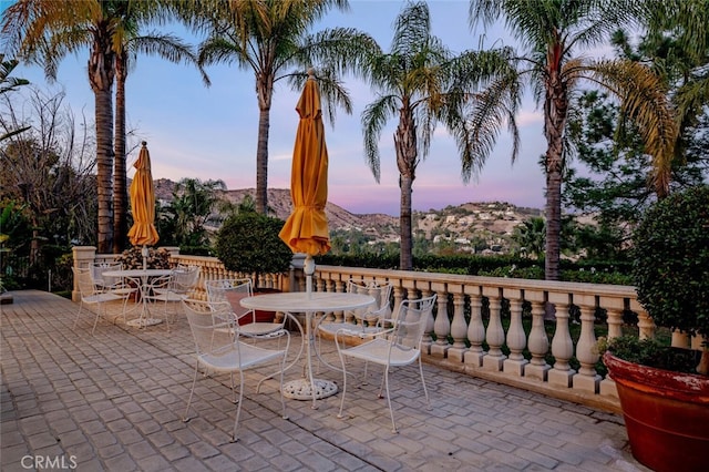 patio terrace at dusk with a mountain view