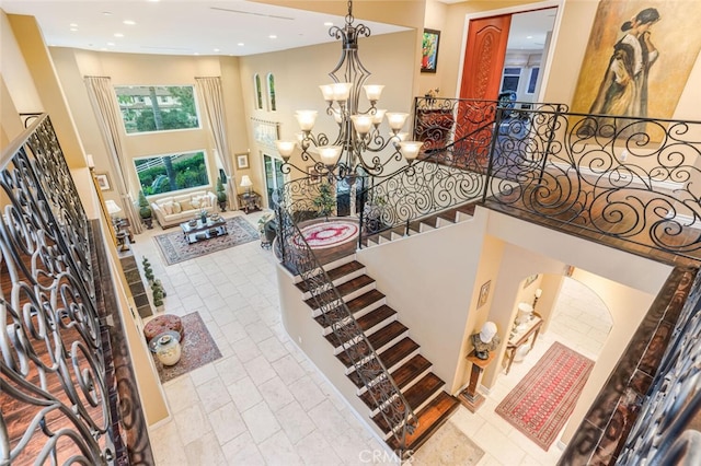 27 Round Up Rd, Bell Canyon, CA 91307 - stairway featuring a towering ceiling, a chandelier, and recessed lighting