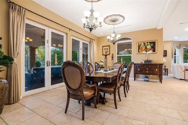 27 Round Up Rd, Bell Canyon, CA 91307 - dining area featuring stone tile floors, a chandelier, and french doors