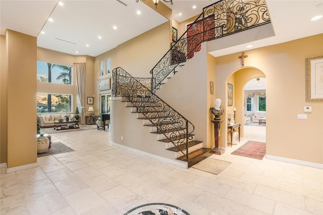 27 Round Up Rd, Bell Canyon, CA 91307 - entrance foyer with arched walkways, a high ceiling, plenty of natural light, recessed lighting, and stairs