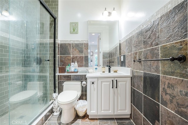 27 Round Up Rd, Bell Canyon, CA 91307 - bathroom with tile walls, a stall shower, toilet, vanity, and wainscoting