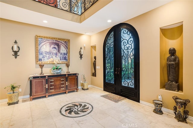 27 Round Up Rd, Bell Canyon, CA 91307 - foyer featuring baseboards, arched walkways, recessed lighting, and french doors