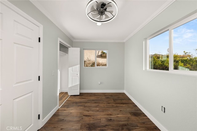 unfurnished bedroom with baseboards, ornamental molding, and dark wood-style floors