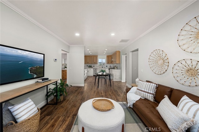 living area with crown molding, visible vents, dark wood finished floors, and baseboards