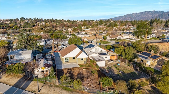 drone / aerial view featuring a residential view and a mountain view