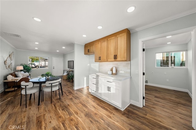 kitchen featuring white cabinets, dark wood-style floors, light countertops, and a wealth of natural light