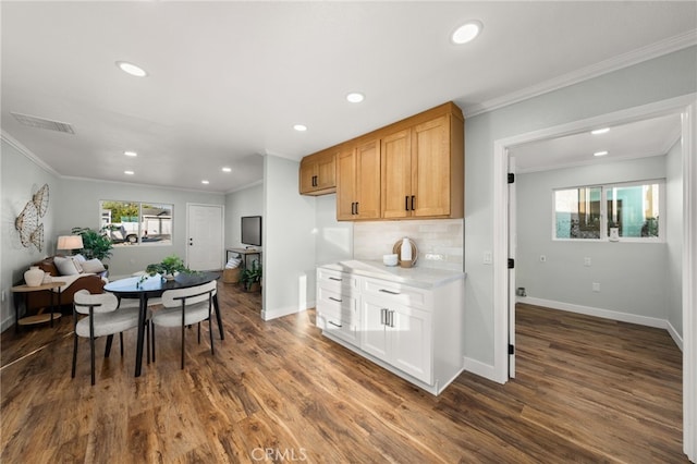 kitchen featuring recessed lighting and ornamental molding
